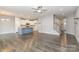 Open-concept living room flowing into a modern kitchen with stairs leading to the upper level at 138 Lanyard Dr # B, Mooresville, NC 28117