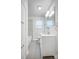 Bright bathroom features a modern vanity, hexagon tile shower, and ample storage space at 1503 Brentwood Dr, Newton, NC 28658