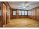 Wood-paneled bedroom with hardwood floors and ample natural light at 1503 Brentwood Dr, Newton, NC 28658