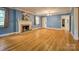 Bright living room with hardwood floors, a fireplace, and ample natural light at 1503 Brentwood Dr, Newton, NC 28658