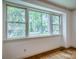 Large window offering a view of lush greenery and trees at 1503 Brentwood Dr, Newton, NC 28658