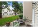 Cozy back patio area with outdoor seating and lovely landscaping, perfect for relaxation at 1572 Edenton Nw St, Concord, NC 28027