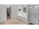 Bright bathroom with a tub, a separate shower, and a window offering plenty of natural light at 1572 Edenton Nw St, Concord, NC 28027