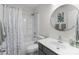 Bathroom with modern vanity, tub/shower combo, and decorative mirror at 1572 Edenton Nw St, Concord, NC 28027