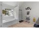 Bright bathroom featuring tub, shower with glass door, tile floor, and lots of natural light at 1572 Edenton Nw St, Concord, NC 28027