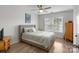 Comfortable bedroom featuring hardwood floors, bright windows and stylish decor at 1572 Edenton Nw St, Concord, NC 28027