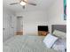 A secondary bedroom with neutral paint, light wood flooring, and a ceiling fan at 1572 Edenton Nw St, Concord, NC 28027