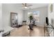Light-filled spare bedroom with an exercise bike, weights and light wood flooring at 1572 Edenton Nw St, Concord, NC 28027