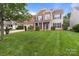 Well-maintained two-story house with a spacious front yard and a convenient two-car garage at 1572 Edenton Nw St, Concord, NC 28027