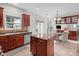 Spacious kitchen with island, stainless steel appliances, and breakfast area for Gathering gatherings at 1572 Edenton Nw St, Concord, NC 28027