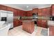 Well-equipped kitchen features stainless steel appliances, granite counters, and a functional center island at 1572 Edenton Nw St, Concord, NC 28027
