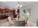 Bright kitchen and dining area features granite countertops and stainless steel appliances at 1572 Edenton Nw St, Concord, NC 28027