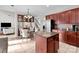 Open kitchen with granite island, stainless steel appliances, and adjacent dining area at 1572 Edenton Nw St, Concord, NC 28027
