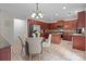 Eat-in kitchen featuring an island, stainless steel appliances, and an adjacent dining area at 1572 Edenton Nw St, Concord, NC 28027