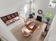 Aerial view of living room with high ceilings, fireplace, and seamless flow into kitchen for modern living at 1572 Edenton Nw St, Concord, NC 28027
