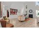 Inviting living area boasts natural light, fireplace, and seamless flow into kitchen for easy entertaining at 1572 Edenton Nw St, Concord, NC 28027