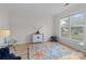 Bright living room with large window, hardwood floors and stylish decor at 1572 Edenton Nw St, Concord, NC 28027