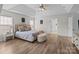 Bright, spacious main bedroom features a tray ceiling, wood floors and ensuite access at 1572 Edenton Nw St, Concord, NC 28027