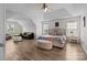 Spacious main bedroom features a sitting area, natural light, and neutral tones at 1572 Edenton Nw St, Concord, NC 28027