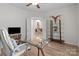 Bright office space with hard wood floors, glass desk, ceiling fan, and a decorative shelving unit at 1572 Edenton Nw St, Concord, NC 28027