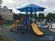 Fun-filled playground with slides and climbing structures, offering a safe and engaging play area at 1572 Edenton Nw St, Concord, NC 28027