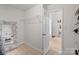 Large walk-in closet with a mirror, custom shelving, and neutral paint at 1572 Edenton Nw St, Concord, NC 28027