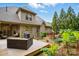 Backyard view featuring a deck, grilling area, seating around a fire pit, and landscaping at 1705 Townsend Ln, Rock Hill, SC 29730
