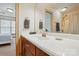 Bathroom with a well-lit vanity, large mirror, and convenient access to the bedroom at 1705 Townsend Ln, Rock Hill, SC 29730