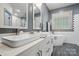Modern bathroom with double sinks, a soaking tub, subway tile, gray walls, and a dark wood floor at 1705 Townsend Ln, Rock Hill, SC 29730