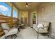Relaxing covered porch with stylish seating, fan, string lights, and outdoor decor at 1705 Townsend Ln, Rock Hill, SC 29730
