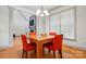 Dining room featuring hardwood floors, natural light, and a view of the fireplace at 1705 Townsend Ln, Rock Hill, SC 29730