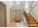 Bright foyer with a staircase and tile flooring leading to the main level of the home, bathed in natural light at 1705 Townsend Ln, Rock Hill, SC 29730