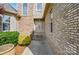 Welcoming front entrance with a stone and brick facade, complemented by well-maintained landscaping and a stylish front door at 1705 Townsend Ln, Rock Hill, SC 29730