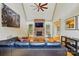 Spacious living room with hardwood floors, vaulted ceiling, a stone fireplace, and a large TV for cozy gatherings at 1705 Townsend Ln, Rock Hill, SC 29730