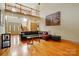 Bright living room features a large sectional sofa, hardwood floors and high ceilings at 1705 Townsend Ln, Rock Hill, SC 29730