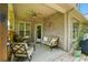 Back porch with comfortable seating, ceiling fan, and decorative string lights, perfect for relaxing at 1705 Townsend Ln, Rock Hill, SC 29730