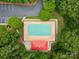 Overhead aerial shot of a rectangular community pool, sundeck, pool house, and lounge chairs at 1705 Townsend Ln, Rock Hill, SC 29730