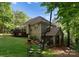 Spacious backyard showcasing a deck, patio, lush lawn, and mature trees at 171 Secretariat Dr, Mooresville, NC 28117