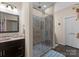 The bathroom includes a shower with glass doors, and a granite countertop with a sink and dark brown cabinetry at 171 Secretariat Dr, Mooresville, NC 28117