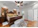 Opulent main bedroom featuring hardwood floors, tray ceilings, and decorative details at 171 Secretariat Dr, Mooresville, NC 28117