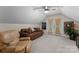 Bright bonus room with a cozy sofa, recliner, and French doors, providing a relaxed and inviting atmosphere at 171 Secretariat Dr, Mooresville, NC 28117