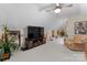 Spacious bonus room with a ceiling fan, large TV, comfortable seating, and ample space for entertaining at 171 Secretariat Dr, Mooresville, NC 28117