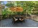 Outdoor deck with seating perfect for enjoying the peaceful surroundings of the landscaped backyard at 171 Secretariat Dr, Mooresville, NC 28117