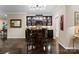 Stylish dining area featuring a high-top table, bar stools, a wine fridge, and custom cabinets at 171 Secretariat Dr, Mooresville, NC 28117