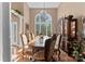 Elegant dining room with a large window, chandelier, and ornate furnishings at 171 Secretariat Dr, Mooresville, NC 28117