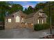 Charming brick home featuring an attached garage, balcony, well-manicured landscaping and a large front yard at 171 Secretariat Dr, Mooresville, NC 28117