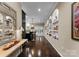 This spacious hallway features niche shelving, polished concrete floors, and a view into an open concept living space at 171 Secretariat Dr, Mooresville, NC 28117