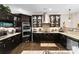 This kitchen features dark wood cabinetry, granite countertops, stainless steel appliances, and display cabinets at 171 Secretariat Dr, Mooresville, NC 28117