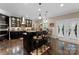 This kitchen features an island with barstool seating, pendant lighting, and modern stainless steel appliances at 171 Secretariat Dr, Mooresville, NC 28117