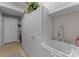 Bright laundry room features white cabinetry, utility sink, and neutral paint, offering a clean and functional space at 171 Secretariat Dr, Mooresville, NC 28117